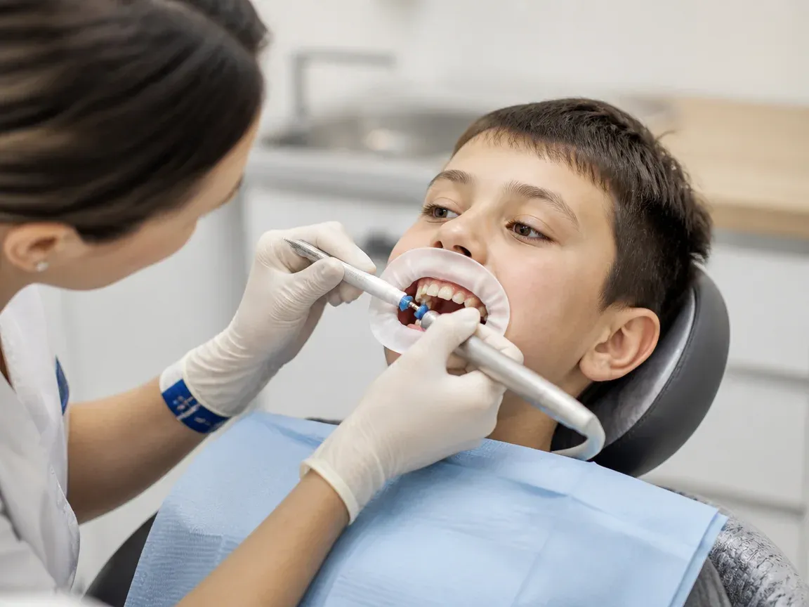 The treatment stage itself: the doctor's gloved hands working inside the oral cavity — an illustration for the "Polishing and Fluoridation" section