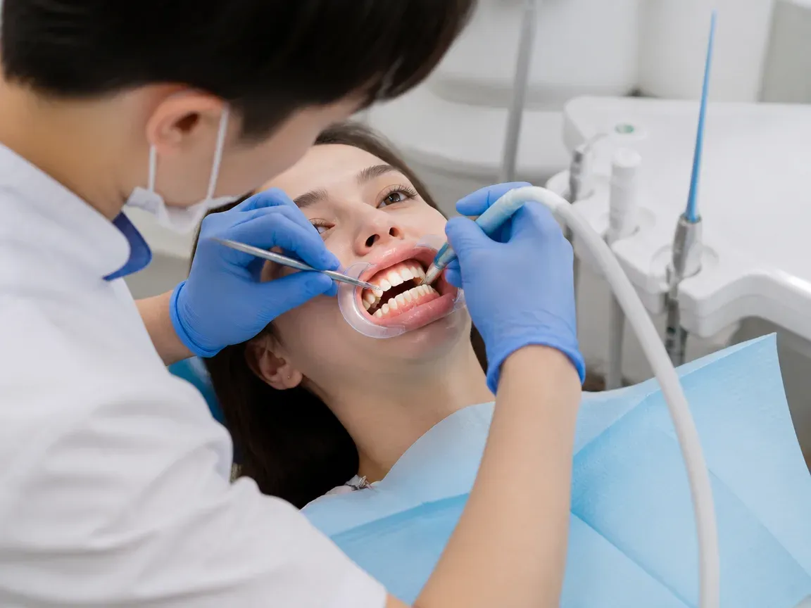 The treatment stage itself: the doctor's gloved hands working inside the oral cavity — an illustration for the "Surgical Stage" section