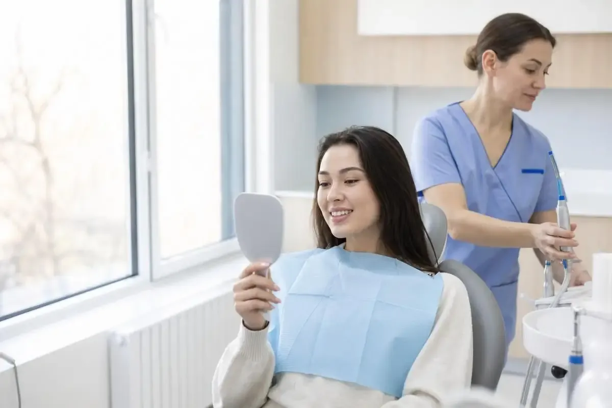 Patient after professional dental cleaning at Dental-Center clinic